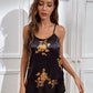 Pyjama satiné noir avec des fleurs orange