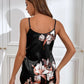 Pyjama satiné noir avec des fleurs blanches et roses